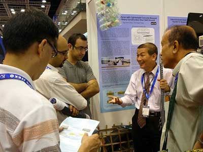 Dr.Low (second from right) explaining to visitors at ITEX 2011