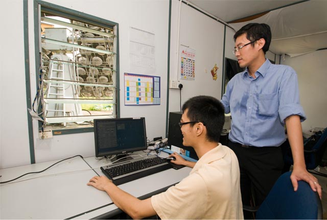 Prof Chong (right) and his student in the control room