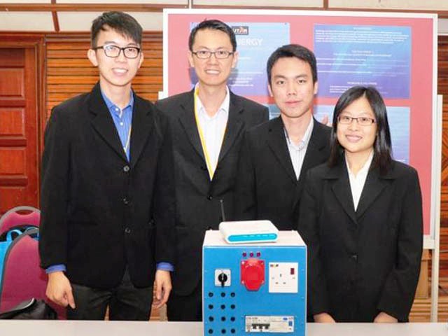 Team leader Chua (second from left) and his team-mates with 'Dr Energy'
