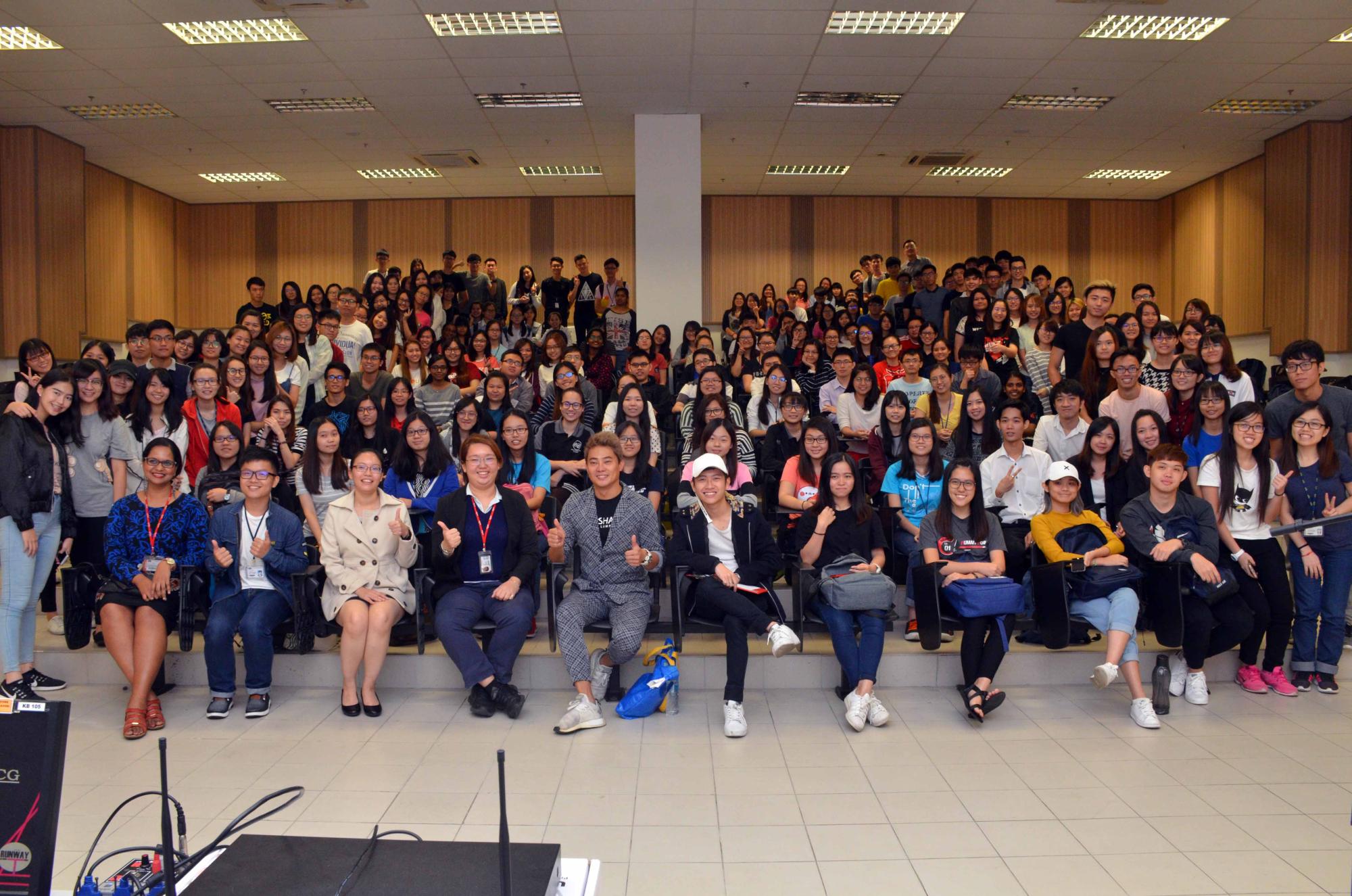 Toong (seated, fifth from left) and the audience